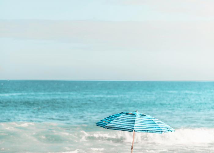 beach setup with umbrella on beach in kauai
