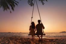 couple sitting together on beach