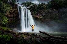 man at a waterfall in Hawaii