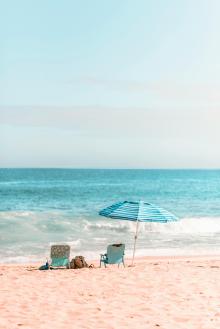 beach setup with umbrella on beach in kauai