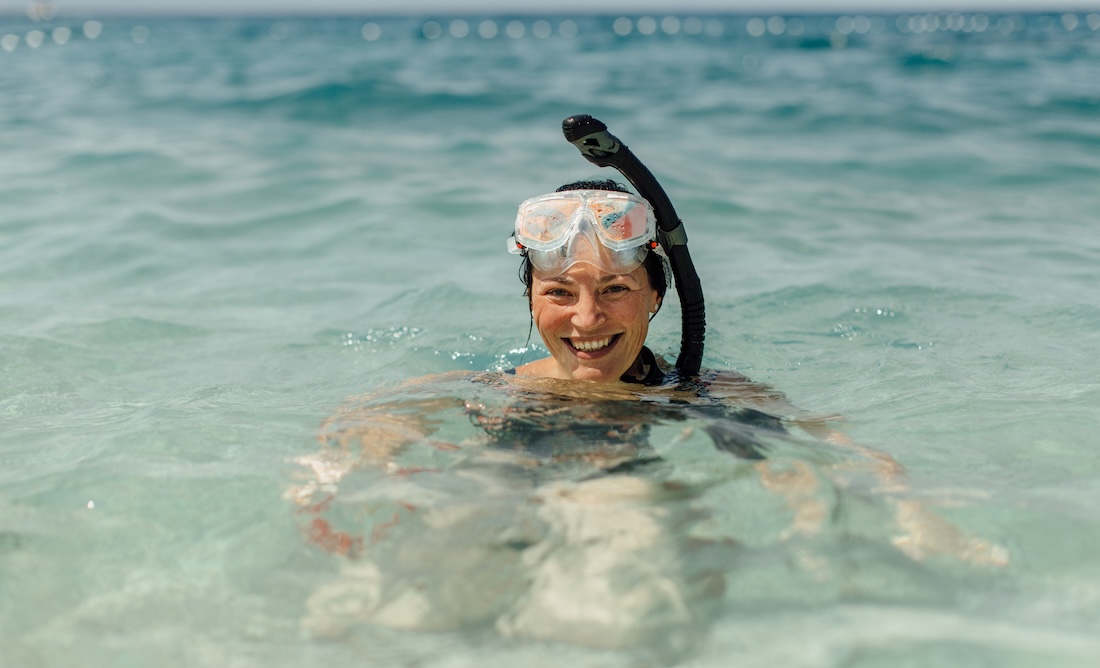 A woman wearing snorkeling gear.
